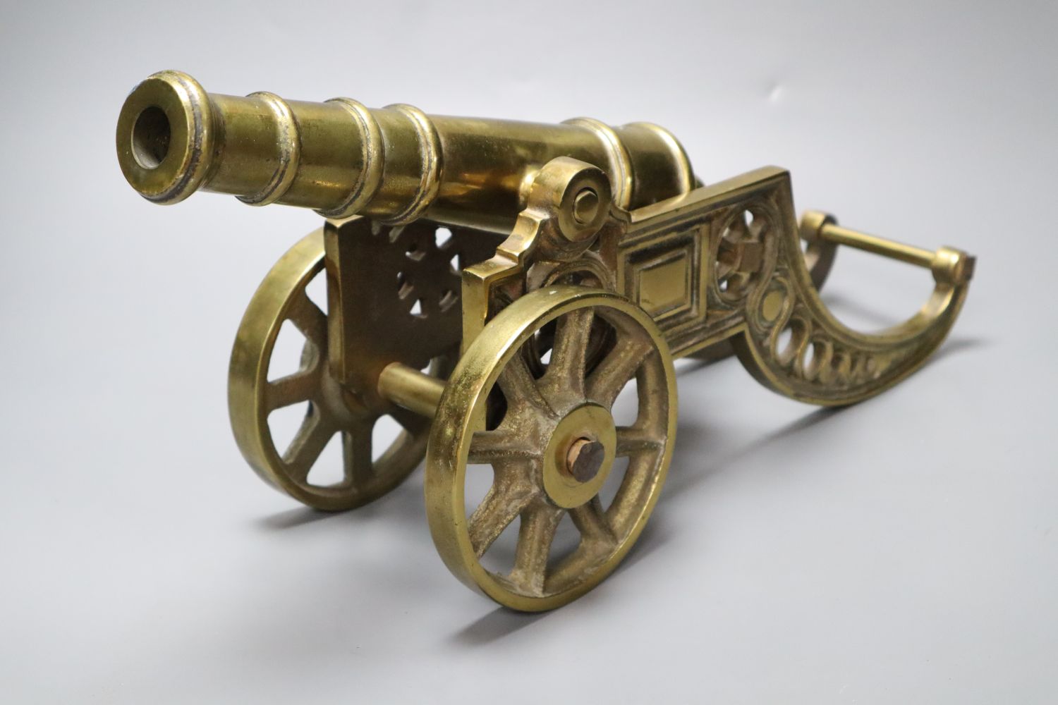 A large brass signal cannon on elaborate carriage, length 42cm